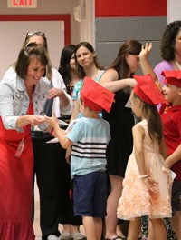 students at kindergarten graduation