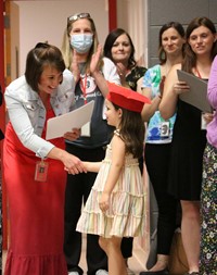 students at kindergarten graduation