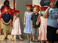 students at kindergarten graduation