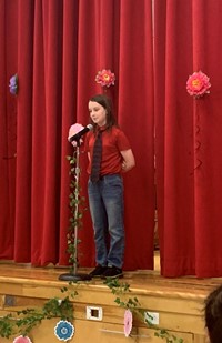 student at poetry recitation