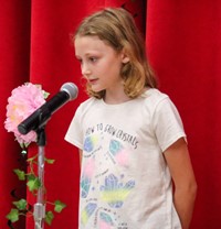 student at poetry recitation