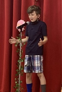 student at poetry recitation