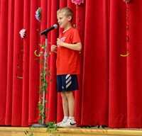 student at poetry recitation