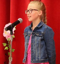 student at poetry recitation