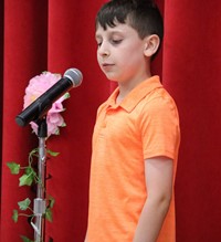 student at poetry recitation