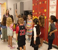 students and teacher on first day of school