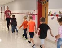 students and teacher on first day of school