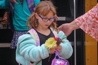 student holding flower