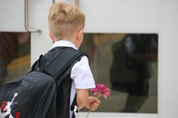 student holding flower