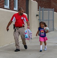 student and S R O on first day of school