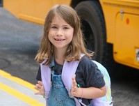 student smiling on first day of school