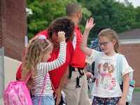 students and principal on first day of school