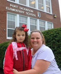 student and family member on first day of school