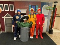 staff in Halloween costumes