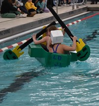students at middle school cardboard boat races