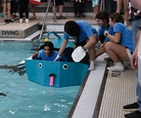 students at middle school cardboard boat races