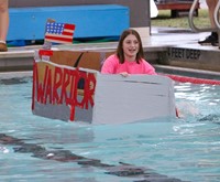 students participating in middle school boat races