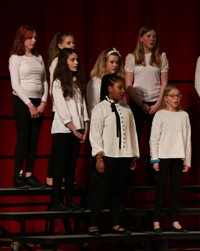 students singing in district choral concert