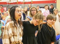 people at fifth grade graduation ceremony