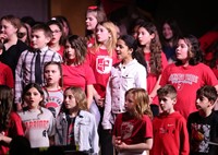 students singing in choral concert