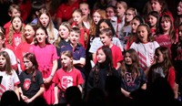 students singing in choral concert