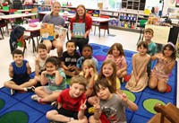 11th graders reading to Port Dickinson Elementary students
