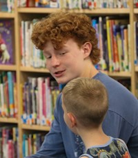 11th graders reading to Port Dickinson Elementary students