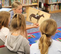 11th graders reading to Port Dickinson Elementary students