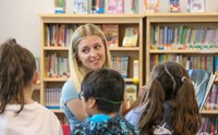 11th graders reading to Port Dickinson Elementary students