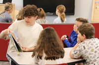 11th graders reading to Port Dickinson Elementary students