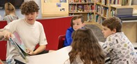 11th graders reading to Port Dickinson Elementary students