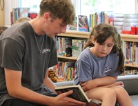 11th graders reading to Port Dickinson Elementary students