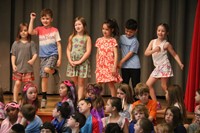 students participating in first grade show