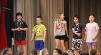 students participating in first grade show