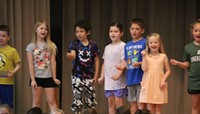 students participating in first grade show