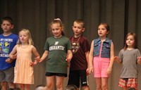 students participating in first grade show