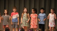 students participating in first grade show