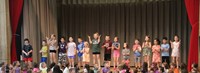 students participating in first grade show