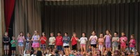 students participating in first grade show