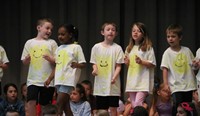 students participating in first grade show