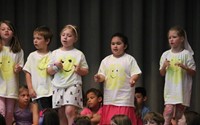 students participating in first grade show