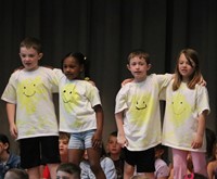 students participating in first grade show