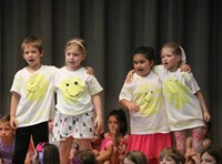students participating in first grade show