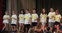 students participating in first grade show