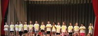 students participating in first grade show