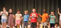 students participating in first grade show