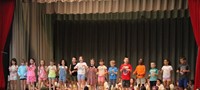 students participating in first grade show