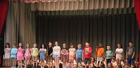 students participating in first grade show