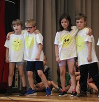 students participating in first grade show