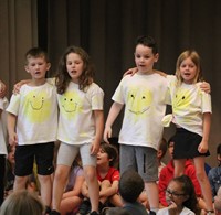 students participating in first grade show